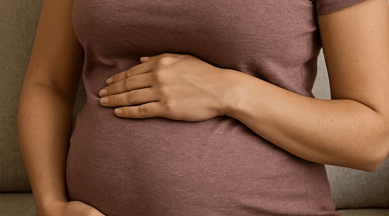 Pregnant person sitting on a couch